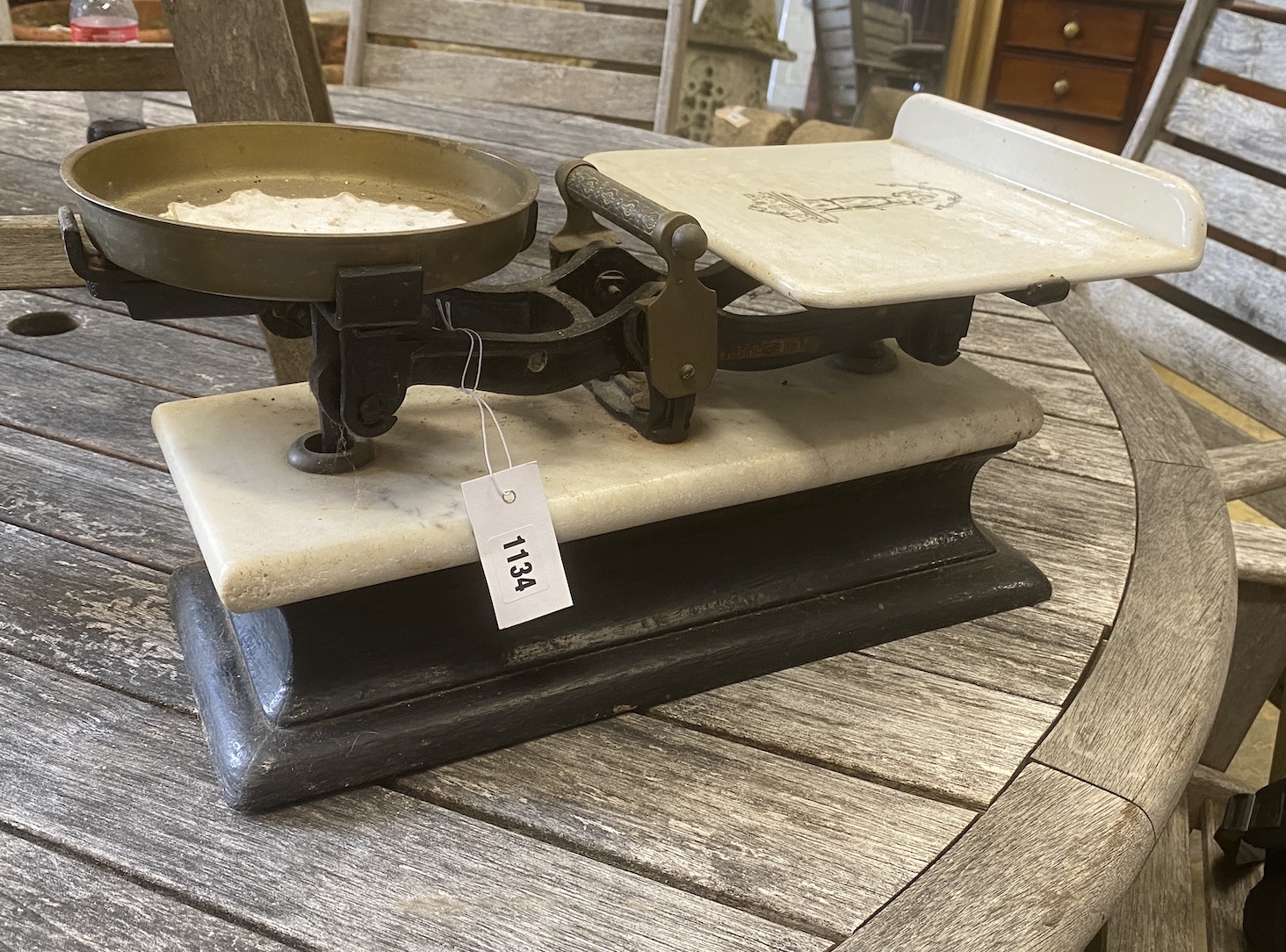 A set of Victorian brass mounted cast iron and white marble scales, width 48cm, depth 26cm, height 21cm